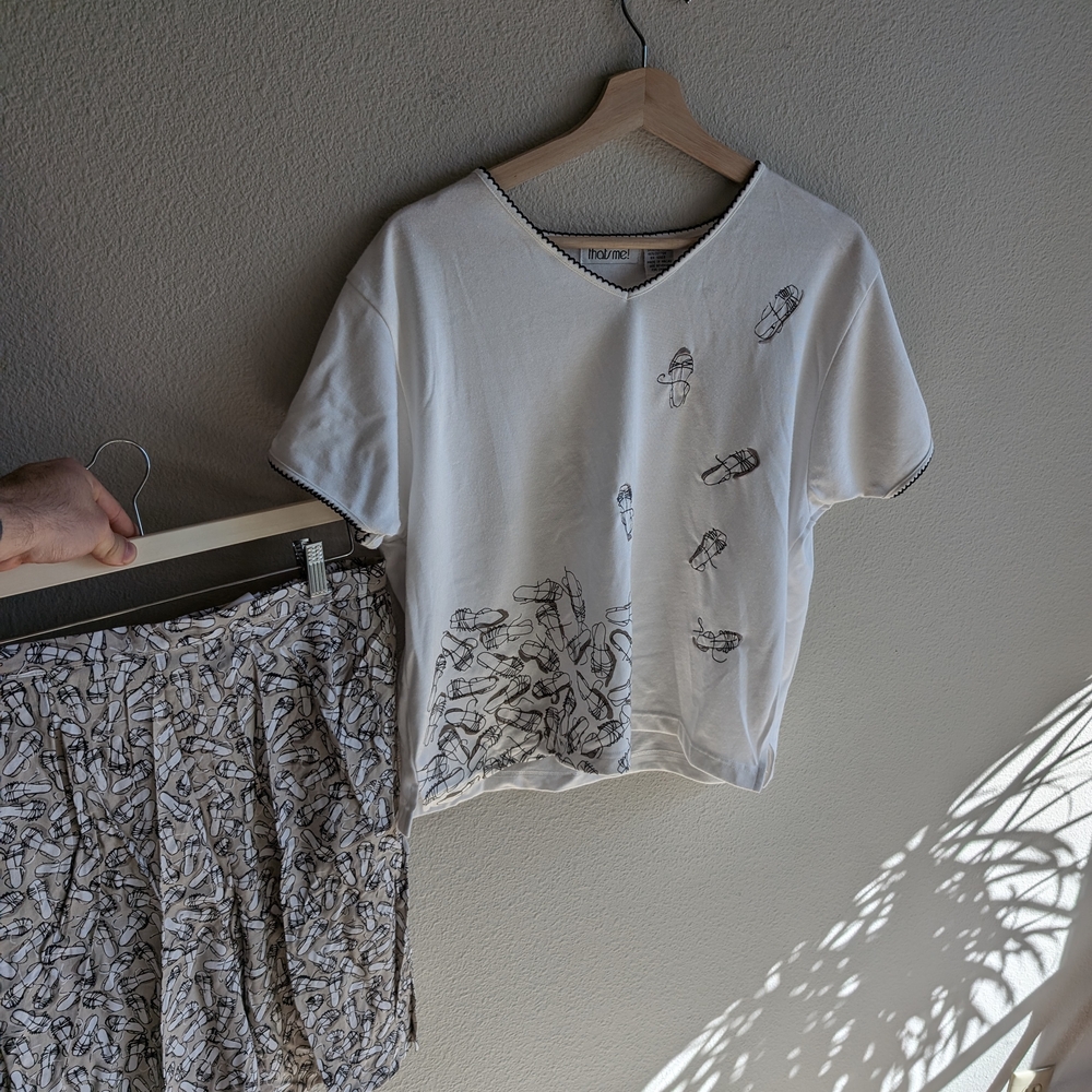 White Graphic Tee and Patterned Skirt Set